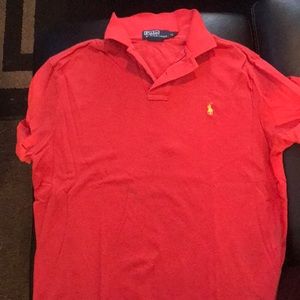 Orange and white striped polo shirt